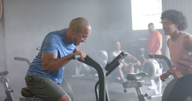 Diverse Group Enjoying Intense Workout Session at Modern Gym - Download Free Stock Images Pikwizard.com