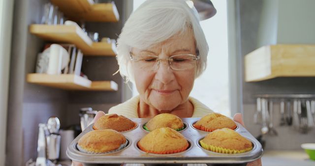 Senior Woman Baking Homemade Cupcakes in Cozy Kitchen - Download Free Stock Images Pikwizard.com