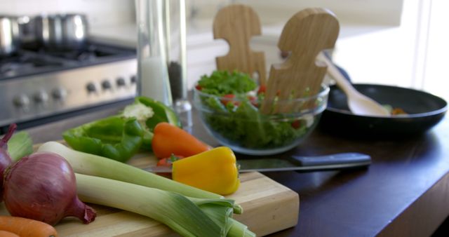 Kitchen Counter with Fresh Vegetables and Bowl of Salad for Cooking Inspiration - Download Free Stock Images Pikwizard.com