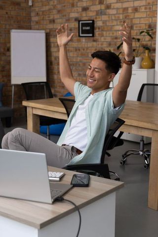 Energetic Young Professional Relaxing in Modern Office Environment