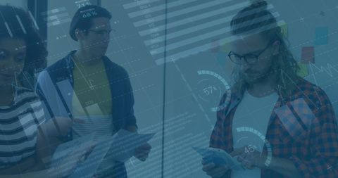 Diverse team analyzing business data and statistics at office