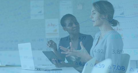 Collaborative Colleagues Analyzing Data with Technology in Modern Office