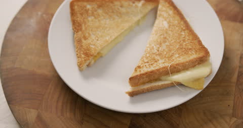 Freshly Made Cheese Sandwich on White Plate