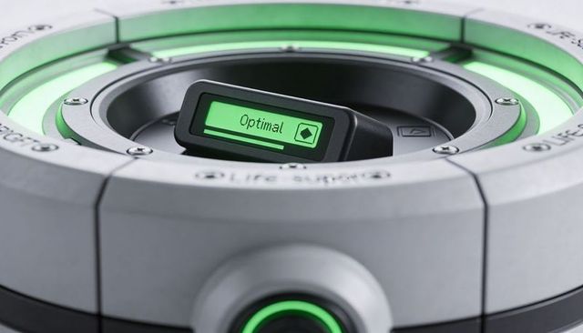 Circular diagnostic cartridge displaying optimal status on green-lit module display