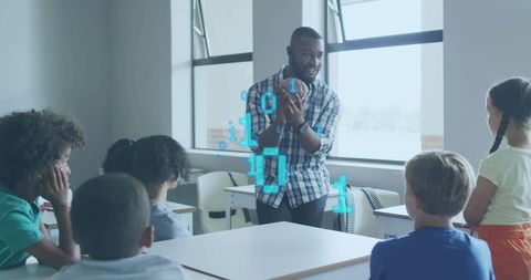 Male teacher teaching stem with holographic binary projection and football in classroom