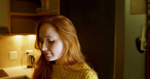 Pensive Young Woman in Cozy Kitchen with Warm Lighting - Download Free Stock Images Pikwizard.com