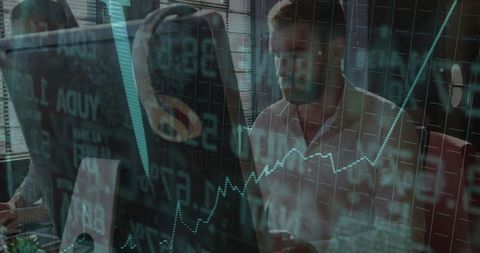 Professional analyst studying financial data on screen in modern office