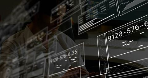 Man Typing and Monitoring Multiscreen Data Dashboards with Transparent GUI Overlays