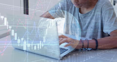 Student Analyzing Financial Data on Laptop in Classroom