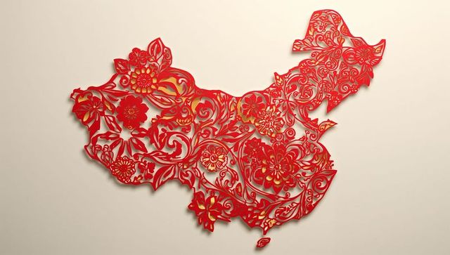 Intricate floral paper-cut map of china on beige