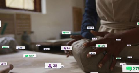 Hands shaping clay with social media engagement icons overlay, artisan workshop