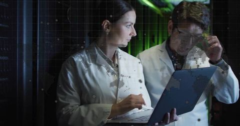 Scientists with Laptop Examining Server Technology and Cybersecurity