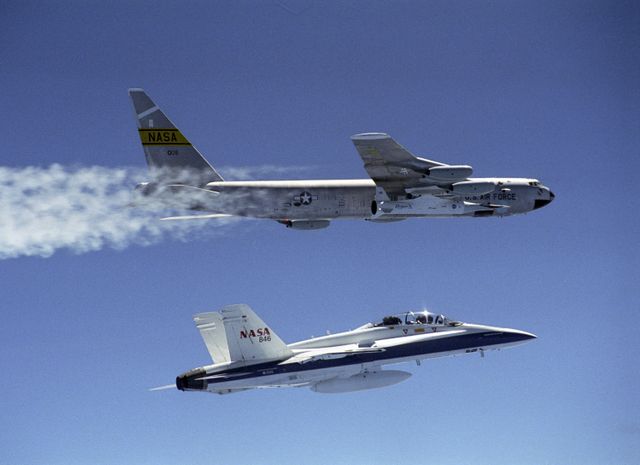 The second X-43A hypersonic research aircraft, attached to a modified Pegasus booster rocket and followed by a chase F-18, was taken to launch altitude by NASA's B-52B launch aircraft from the NASA Dryden Flight Research Center at Edwards Air Force Base, Calif., on March 27, 2004. About an hour later the Pegasus booster was released from the B-52 to accelerate the X-43A to its intended speed of Mach 7. In a combined research effort involving Dryden, Langley, and several industry partners, NASA demonstrated the value of its X-43A hypersonic research aircraft, as it became the first air-breathing, unpiloted, scramjet-powered plane to fly freely by itself. The March 27 flight, originating from NASA's Dryden Flight Research Center, began with the Agency's B-52B launch aircraft carrying the X-43A out to the test range over the Pacific Ocean off the California coast. The X-43A was boosted up to its test altitude of about 95,000 feet, where it separated from its modified Pegasus booster and flew freely under its own power.  Two very significant aviation milestones occurred during this test flight: first, controlled accelerating flight at Mach 7 under scramjet power, and second, the successful stage separation at high dynamic pressure of two non-axisymmetric vehicles. To top it all off, the flight resulted in the setting of a new aeronautical speed record. The X-43A reached a speed of over Mach 7, or about 5,000 miles per hour faster than any known aircraft powered by an air-breathing engine has ever flown.