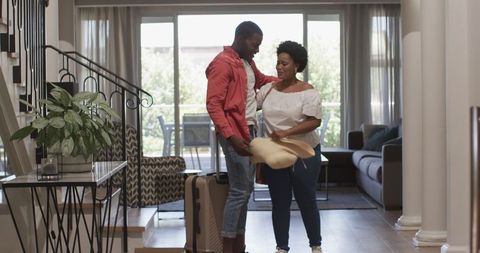 Joyful reunion: couple embracing after returning home