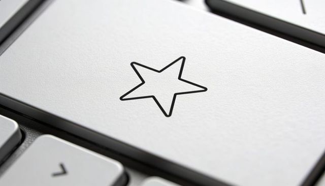 Macro closeup silver keyboard star keycap showing texture for favorites and ratings ui