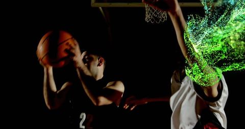 Basketball player driving to rim with explosive green motion trail defender contesting shot