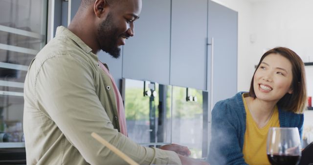 Multiracial Couple Enjoying Cooking Together in Modern Kitchen - Download Free Stock Images Pikwizard.com