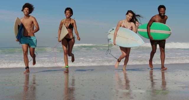 Young Friends Running on Beach with Surfboards - Download Free Stock Images Pikwizard.com