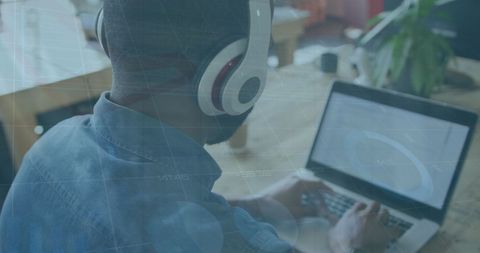 Data Analysis with Headphones in Modern Office