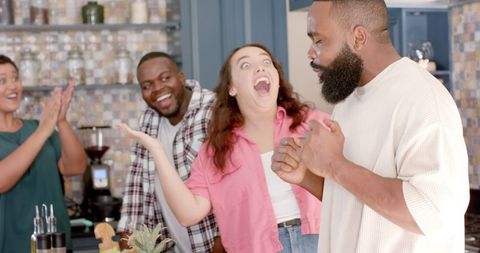 Joyful Friends Bonding in Modern Kitchen Setting