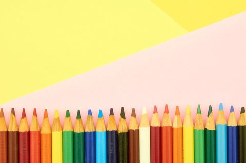Colorful Pencils Neatly Aligned Against Pastel Background