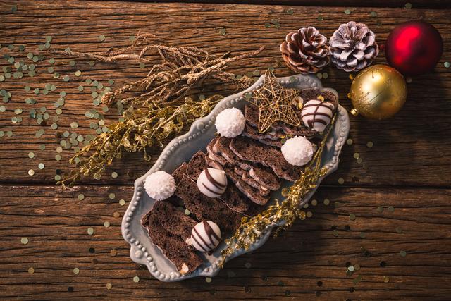 Christmas dessert and christmas decoration on wooden table