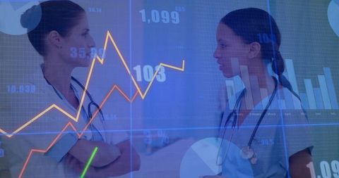 Healthcare professionals analyzing digital medical data and charts