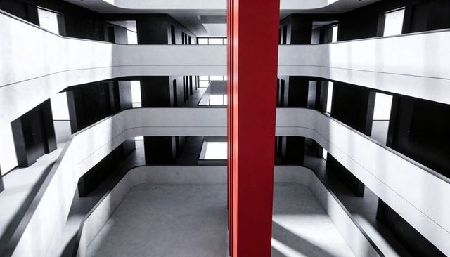 Red column drawing eye upward in minimalist atrium with curved balconies and shadows