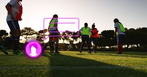 Dynamic soccer game at sunset with players and technology