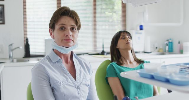 Confident Female Dentist with Patient in Chair - Download Free Stock Images Pikwizard.com