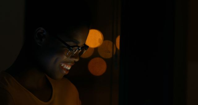 Smiling Young Woman Using Digital Device at Night with City Lights - Download Free Stock Images Pikwizard.com