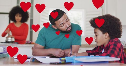 Father and Son Bonding During Homework with Social Media Hearts