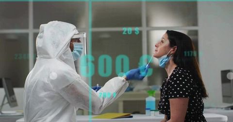 Healthcare worker performing covid-19 test on woman