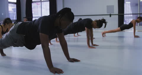 Dancers Practicing Routine in Bright Studio