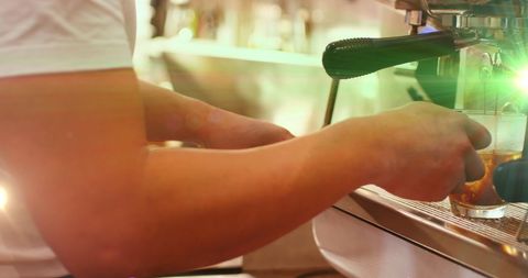 Barista crafting fresh espresso in cozy café scene