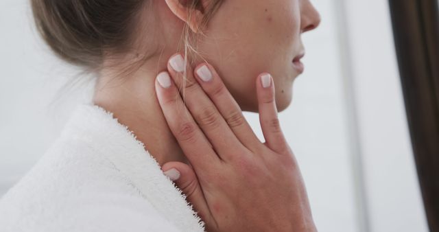 Close-Up of Woman's Neck with Hand Touching - Download Free Stock Images Pikwizard.com