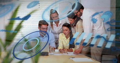 Corporate team collaborating and reviewing documents on laptop with digital HUD overlay