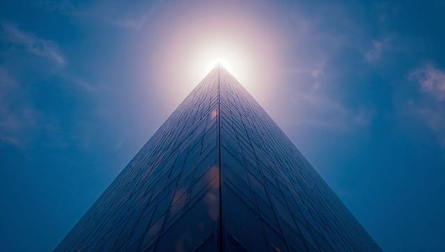 Dazzling Sunlit Skyscraper Spearing a Brilliant Sky