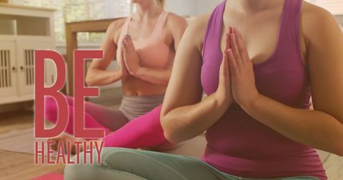 Diverse Females Meditating While Practicing Yoga at Home
