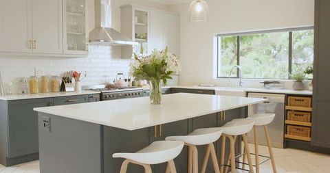 Luxury Modern Kitchen with Marble Island and Fresh Flowers