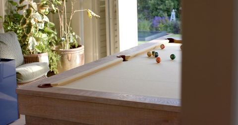 Elegant recreational space with sunlit billiards table