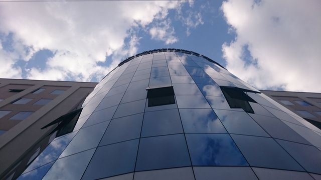 Modern Glass Building Reflecting Cloudy Sky - Download Free Stock Images Pikwizard.com