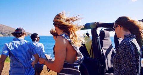Friends Embracing Freedom on a Sunny Beach Adventure