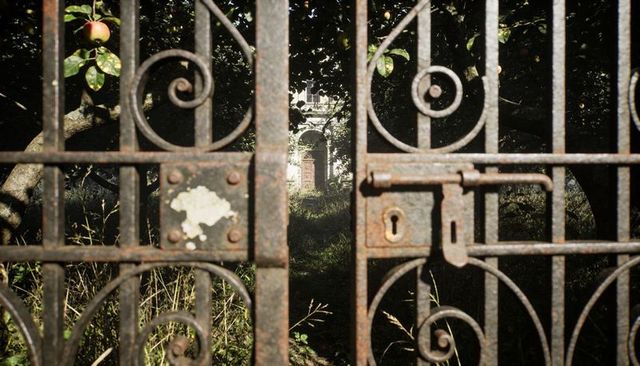 Rusted Ornate Iron Gate Framing Overgrown Garden Path Toward Stone Archway with Apple