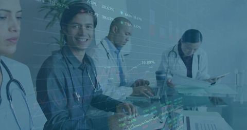 Multicultural medical team analyzing financial trends in modern office