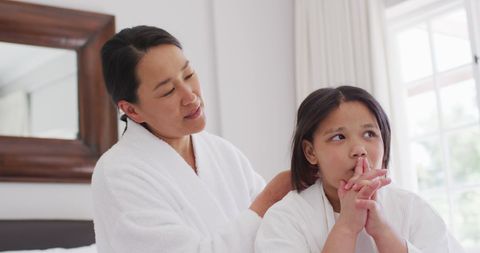 Mother and Daughter Sharing Tender Moment at Home