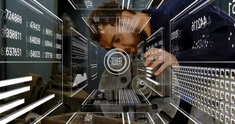 Technician examining metal with ar interface in workshop