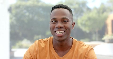 Joyful Man Making Video Call at Home in Relaxed Setting