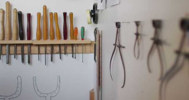 Image of tools hanging on walls in traditional carpentry workshop. Carpentry, craftsmanship, owning a small business and handwork concept.