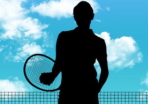 Silhouette of Tennis Player with Racket Against Blue Sky